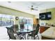 Indoor dining area with views of the screened-in pool. Lots of natural light and tiled floor at 771 Stewart St, Englewood, FL 34223
