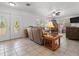 A spacious foyer showcasing neutral walls, tiled floor, and a comfortable seating arrangement at 771 Stewart St, Englewood, FL 34223