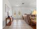 A spacious foyer showcasing neutral walls, tiled floor, and a comfortable seating arrangement at 771 Stewart St, Englewood, FL 34223