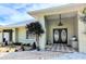 Inviting front entrance with double doors, decorative brick pavers, and attractive landscaping at 771 Stewart St, Englewood, FL 34223