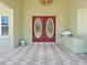 Elegant front entrance with double doors, decorative brickwork, and a decorative water feature at 771 Stewart St, Englewood, FL 34223
