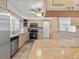 Bright kitchen with stainless steel appliances and light wood cabinetry at 771 Stewart St, Englewood, FL 34223