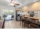 A spacious kitchen with bright cabinets, stainless steel appliances, and a convenient breakfast bar at 771 Stewart St, Englewood, FL 34223