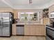 Well-lit kitchen with stainless steel appliances and ample counter space at 771 Stewart St, Englewood, FL 34223