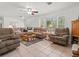 A spacious living room showcasing comfortable sofas, neutral walls, and a tiled floor at 771 Stewart St, Englewood, FL 34223