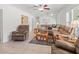 A spacious living room showcasing comfortable sofas, neutral walls, and a tiled floor at 771 Stewart St, Englewood, FL 34223