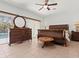 Spacious main bedroom with an oversized dresser and a large window at 771 Stewart St, Englewood, FL 34223