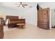 Comfortable main bedroom featuring a large bed and a stylish armoire at 771 Stewart St, Englewood, FL 34223