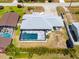 An aerial view of a refreshing screened-in swimming pool, perfect for relaxing and outdoor fun at 771 Stewart St, Englewood, FL 34223