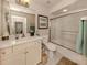Functional bathroom with a shower-tub combo, a single sink vanity, and a large mirror at 800 Gardens Edge Dr # 814, Venice, FL 34285