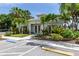 Charming clubhouse featuring well-manicured landscaping and convenient parking at 800 Gardens Edge Dr # 814, Venice, FL 34285