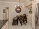 Kitchen dining area with modern table, bench and pendant lighting at 800 Gardens Edge Dr # 814, Venice, FL 34285