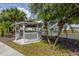 Charming gazebo near a serene pond, offering a peaceful outdoor retreat at 800 Gardens Edge Dr # 814, Venice, FL 34285