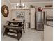 Kitchen and dining area with granite counters, stainless steel appliances, dining table and seating at 800 Gardens Edge Dr # 814, Venice, FL 34285