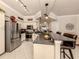 Modern kitchen with granite counters, stainless steel appliances, and an open layout at 800 Gardens Edge Dr # 814, Venice, FL 34285