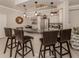 Modern open kitchen with granite counters, stainless steel appliances, dining table and seating at 800 Gardens Edge Dr # 814, Venice, FL 34285