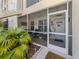 Charming screened-in lanai offering comfortable seating and a welcoming entrance to the home at 800 Gardens Edge Dr # 814, Venice, FL 34285