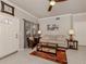 Inviting living room featuring neutral walls, tile floors, and comfortable seating arrangement at 800 Gardens Edge Dr # 814, Venice, FL 34285