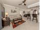 Open-concept living room connects to a dining area and features stylish furnishings at 800 Gardens Edge Dr # 814, Venice, FL 34285