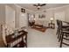 Stylish living room features neutral decor, tile floors, and ample seating for relaxation and entertaining at 800 Gardens Edge Dr # 814, Venice, FL 34285