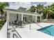 Inviting pool area with ample seating and a covered patio for relaxation at 800 Gardens Edge Dr # 814, Venice, FL 34285