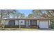 Charming single-story home featuring a well-maintained front yard and attached one car garage at 8155 Mossborger Ave, North Port, FL 34287