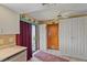 Bright kitchen area with updated appliances, white cabinets, and a door leading to the backyard at 8155 Mossborger Ave, North Port, FL 34287