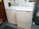 Bright laundry room featuring a full-sized washer and dryer for added convenience at 8155 Mossborger Ave, North Port, FL 34287