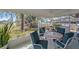 Screened-in patio with outdoor furniture, providing a relaxing space with a view of the backyard at 8155 Mossborger Ave, North Port, FL 34287