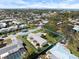 Aerial shot displays the property's proximity to the coast within a lush neighborhood setting at 929 The Rialto, Venice, FL 34285