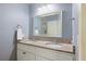 Bathroom featuring a double sink vanity with decorative granite countertops at 929 The Rialto, Venice, FL 34285