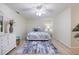 Bright bedroom showcasing a queen bed, white furniture, and soft lighting at 929 The Rialto, Venice, FL 34285