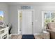 Bright foyer featuring a white front door, and modern decor at 929 The Rialto, Venice, FL 34285