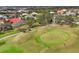 An aerial of a golf course community on a sunny day at 945 Chickadee Dr, Venice, FL 34285