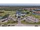 Aerial view of Pelican Pointe Golf and Country Club showcasing the golf course and surrounding community at 945 Chickadee Dr, Venice, FL 34285