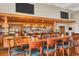 Community bar with ample seating and a well-stocked liquor selection at 945 Chickadee Dr, Venice, FL 34285