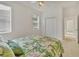 Relaxing bedroom with a ceiling fan, closet, and a large window with blinds at 945 Chickadee Dr, Venice, FL 34285