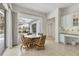 Bright breakfast nook with large windows and view of the pool area at 945 Chickadee Dr, Venice, FL 34285