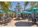 An outdoor courtyard with a fountain and a collection of seating in a peaceful setting at 945 Chickadee Dr, Venice, FL 34285