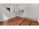 Dining room area showcasing hardwood floors and bright, natural light with pool view at 945 Chickadee Dr, Venice, FL 34285