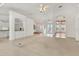 Spacious living room featuring neutral colors and a seamless transition to other areas of the home at 945 Chickadee Dr, Venice, FL 34285