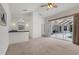 Living room with a built-in wet bar and a sliding glass door to the pool area at 945 Chickadee Dr, Venice, FL 34285
