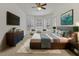Comfortable main bedroom featuring large windows, a modern design and neutral decor at 945 Chickadee Dr, Venice, FL 34285