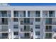 Modern building with multiple balconies offering outdoor spaces and views of the surrounding area, showcasing contemporary design at 101 S Gulfstream Ave # 15H, Sarasota, FL 34236