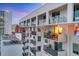 Modern building featuring multiple balconies with glass railings for enjoying city views at 101 S Gulfstream Ave # 15H, Sarasota, FL 34236