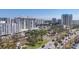 Stunning city view of modern high-rise buildings and lush green landscaping at 101 S Gulfstream Ave # 15H, Sarasota, FL 34236