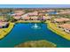 A picturesque aerial view of real estate showing the serene lake and surrounding community at 1022 Yosemite Dr, Englewood, FL 34223