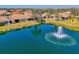 Scenic aerial view showcasing a beautiful pond with a fountain and well-kept homes at 1022 Yosemite Dr, Englewood, FL 34223
