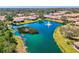 Breathtaking aerial shot capturing the lake, lush greenery, and homes in the community at 1022 Yosemite Dr, Englewood, FL 34223