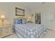Serene bedroom with ensuite bathroom, soft bedding, and neutral-toned decor at 1022 Yosemite Dr, Englewood, FL 34223